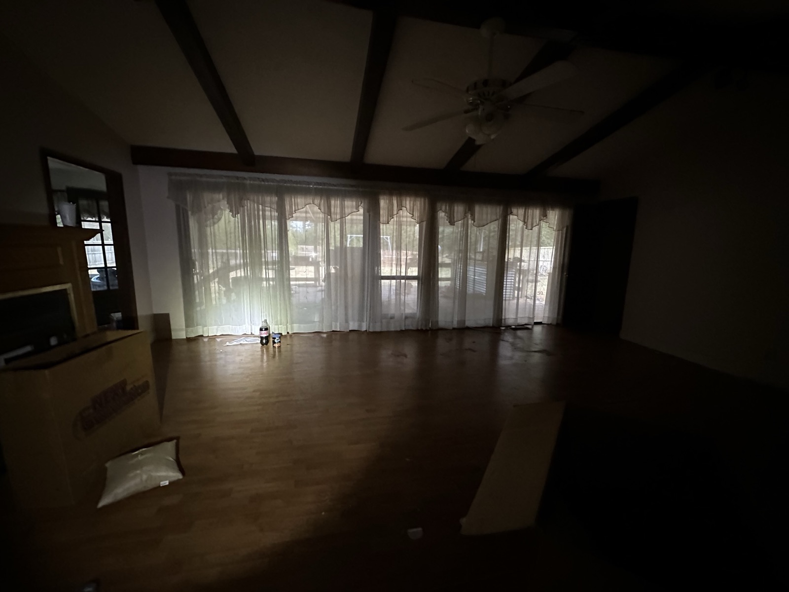 Dim, dated great room before renovation